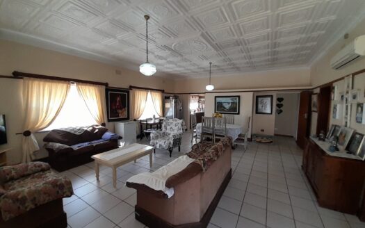 Stunning Nine bedroom home on one stand. A home that's a Dual-Zoned Income Generator with four Flatlets