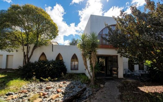 A unique three-bedroom family home for sale on large 1,190m² corner stand in the Upper Rensburg Area.